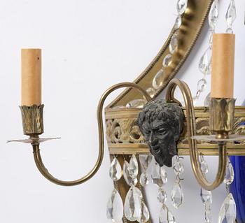 A pair of Russian Louis XVI-style  four-branch gilt bronze appliques, 19th century.