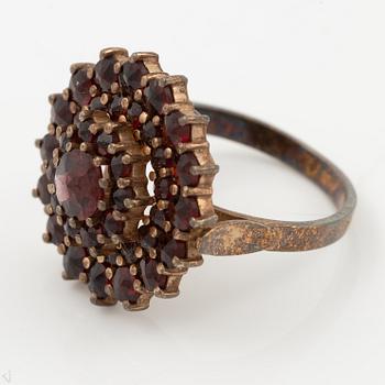 Garniture, two rings, brooch, two necklaces, and two pairs of earrings, armlet, garnets.