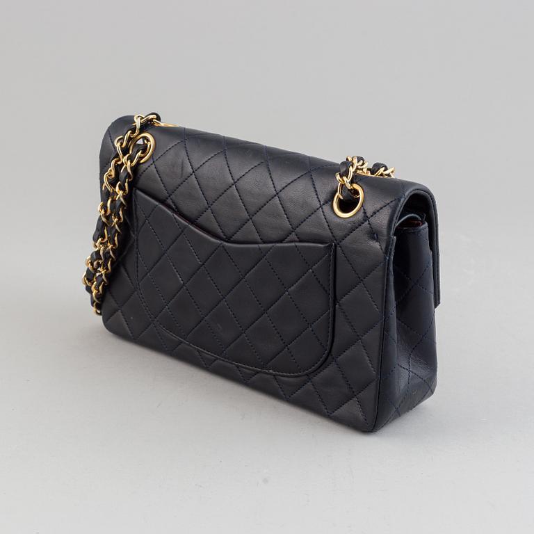 Chanel, a navy leather 'Double Flap Bag', 1989-91.