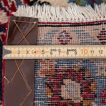 An oriental carpet, a. 419 x 295 cm.