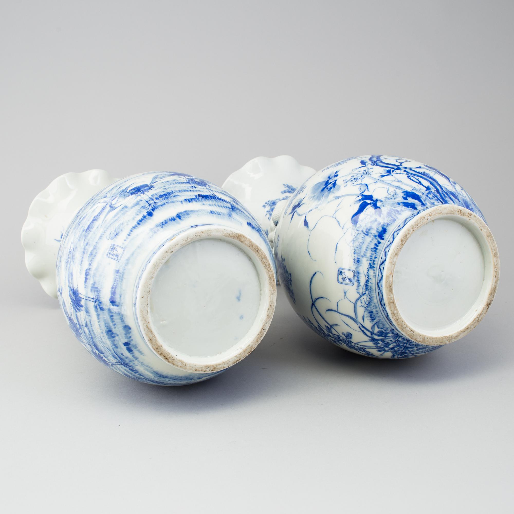 A matched pair of blue and white vases, Japan, early 20th Century.