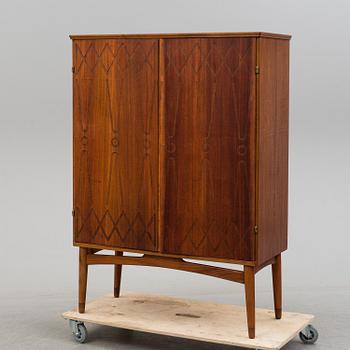 A cabinet veneered with teak designed by Kirke Nielsen for Abrahamssons Möbelfabrik in Smålands Taberg, 1950´s.