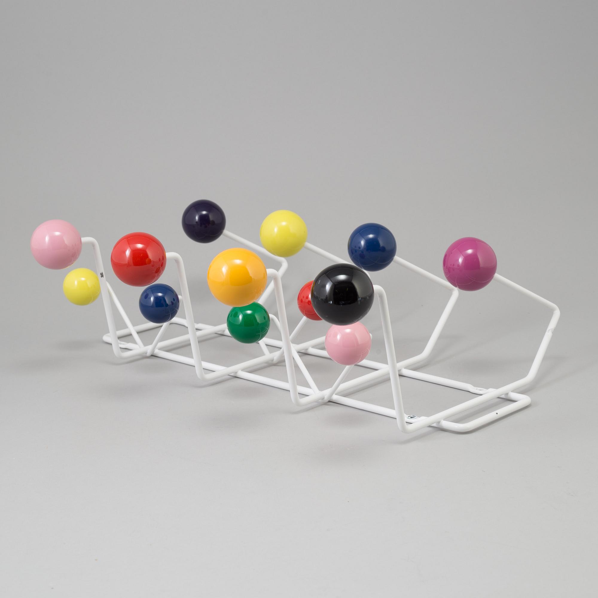 a "Hang it all" clothes hanger by Charles & Ray Eames for Vitra.