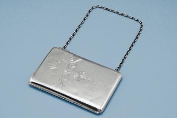 104. A SILVER PURSE.