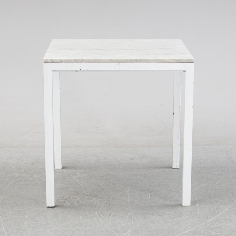 A marble top table, 21th century.