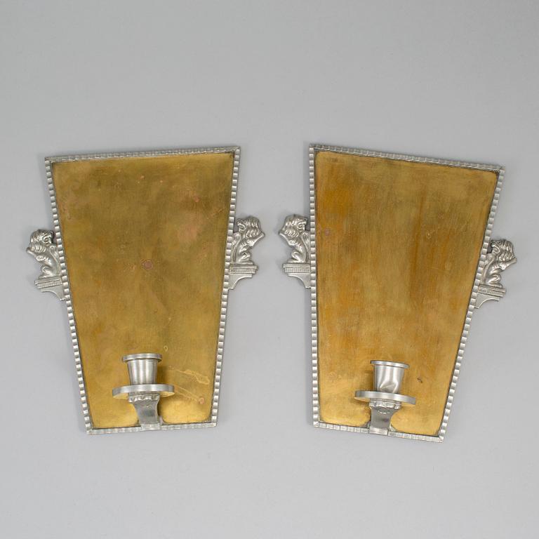 A pair of wall sconces by CG Hallebrg dated 1929.