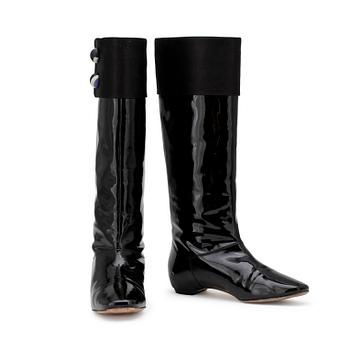 PUCCI, a pair of black patent leather boots.