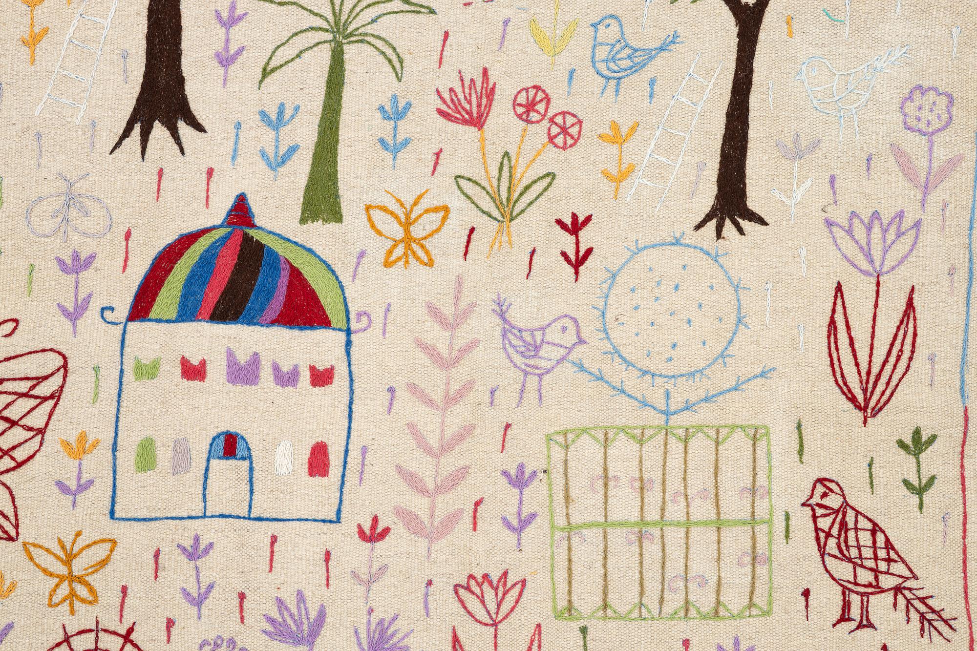 A hand-embroidered Kelim rug, 186 x 123 cm.