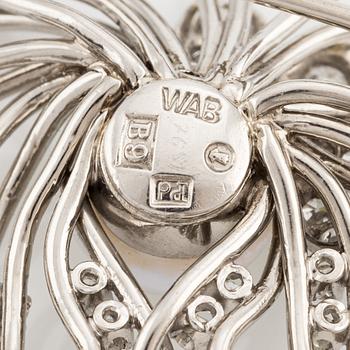A brooch in palladium set with a half pearl and eight-cut diamonds, W.A. Bolin.