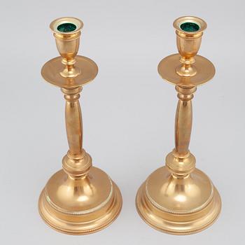 A pair of brass candlesticks from Skultuna, around the year 1900.