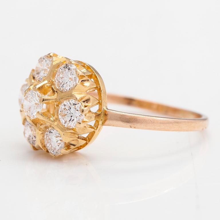 A 14K and 18K gold and diamond cluster ring ca 1.15 ct in total.