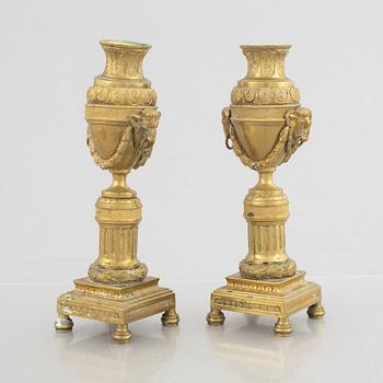 A pair of Louis XVI-style candlesticks, late 19th century.