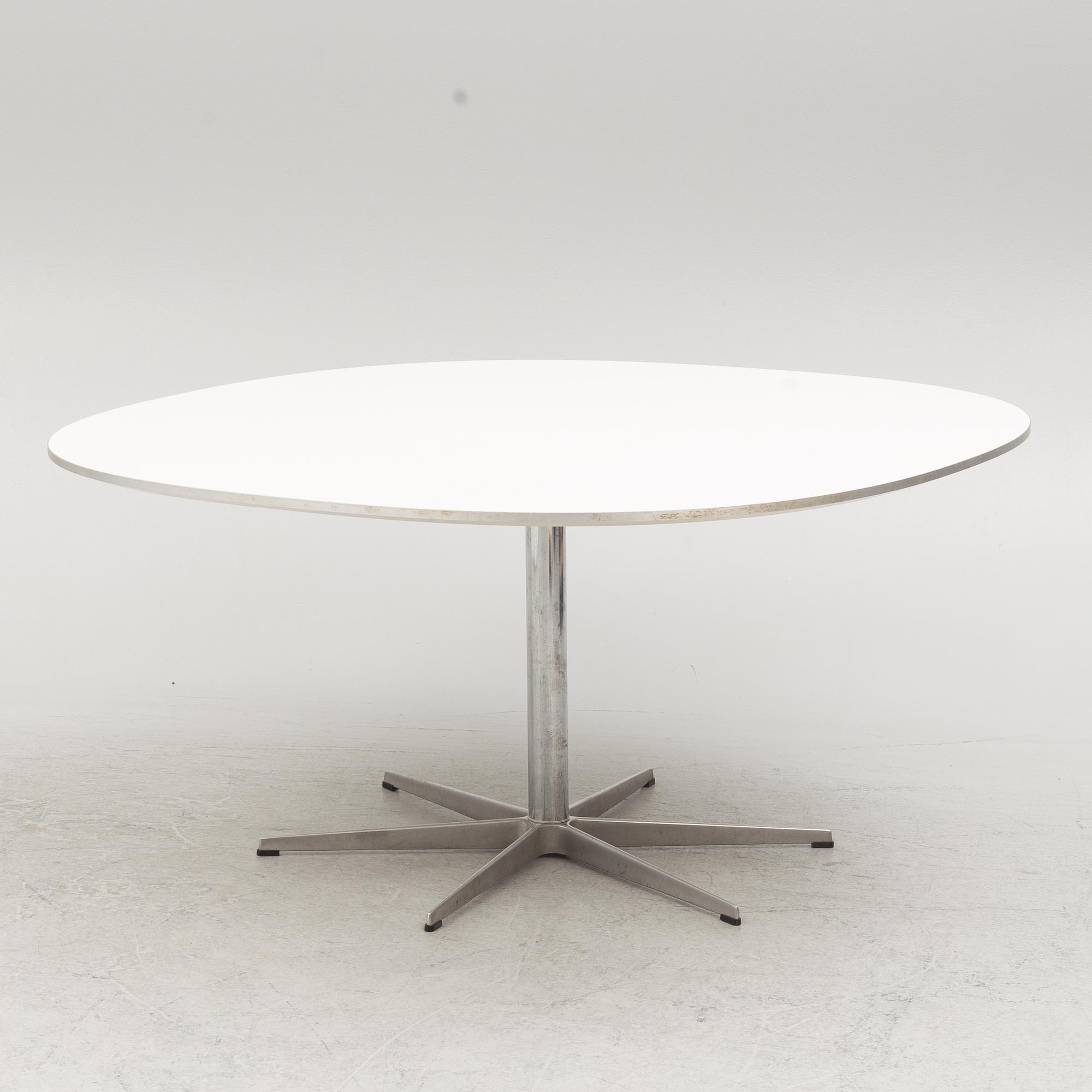 Arne Jacobsen, Bruno Mathsson & Piet Hein, a 'Super circle' dining table, Fritz Hansen, Denmark, 2007.