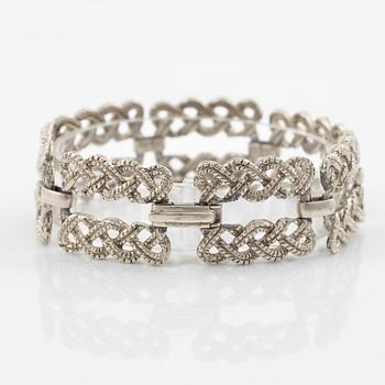 Armband vit metall.