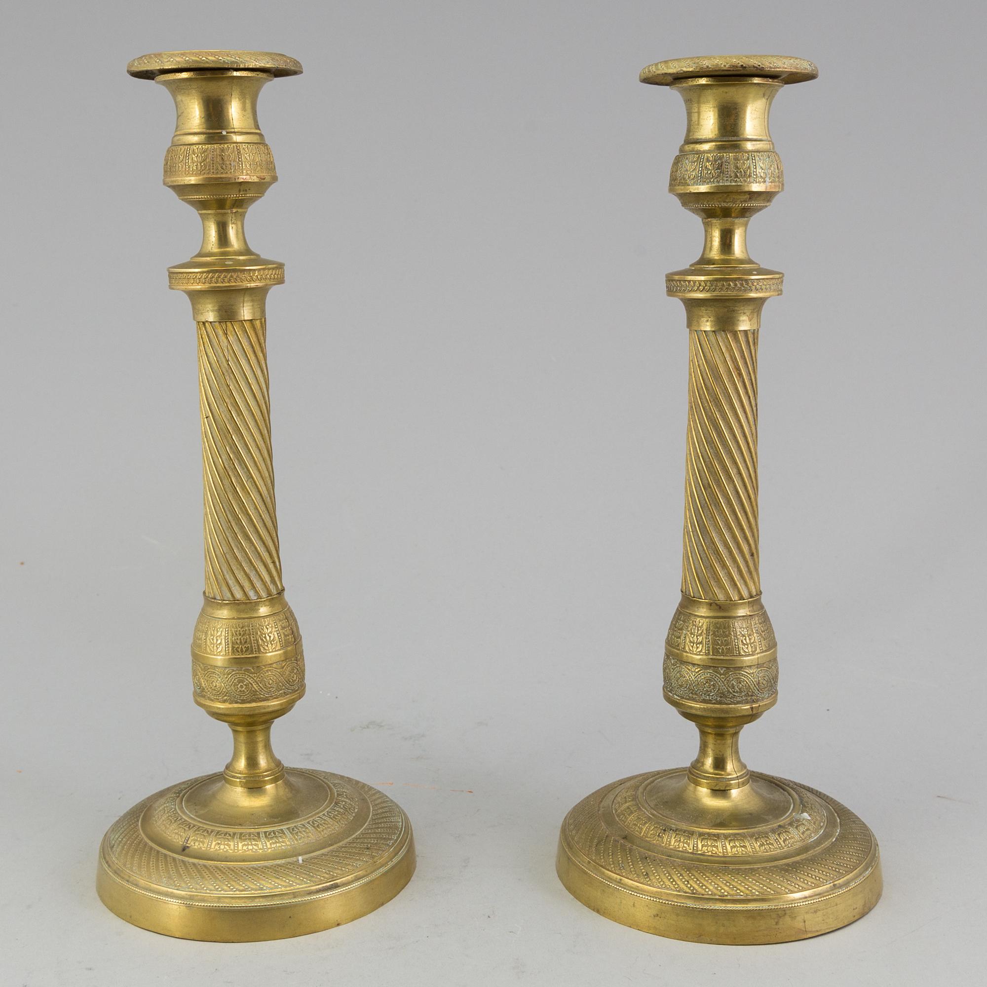 A pair of 'Empire' candlesticks, probably French.