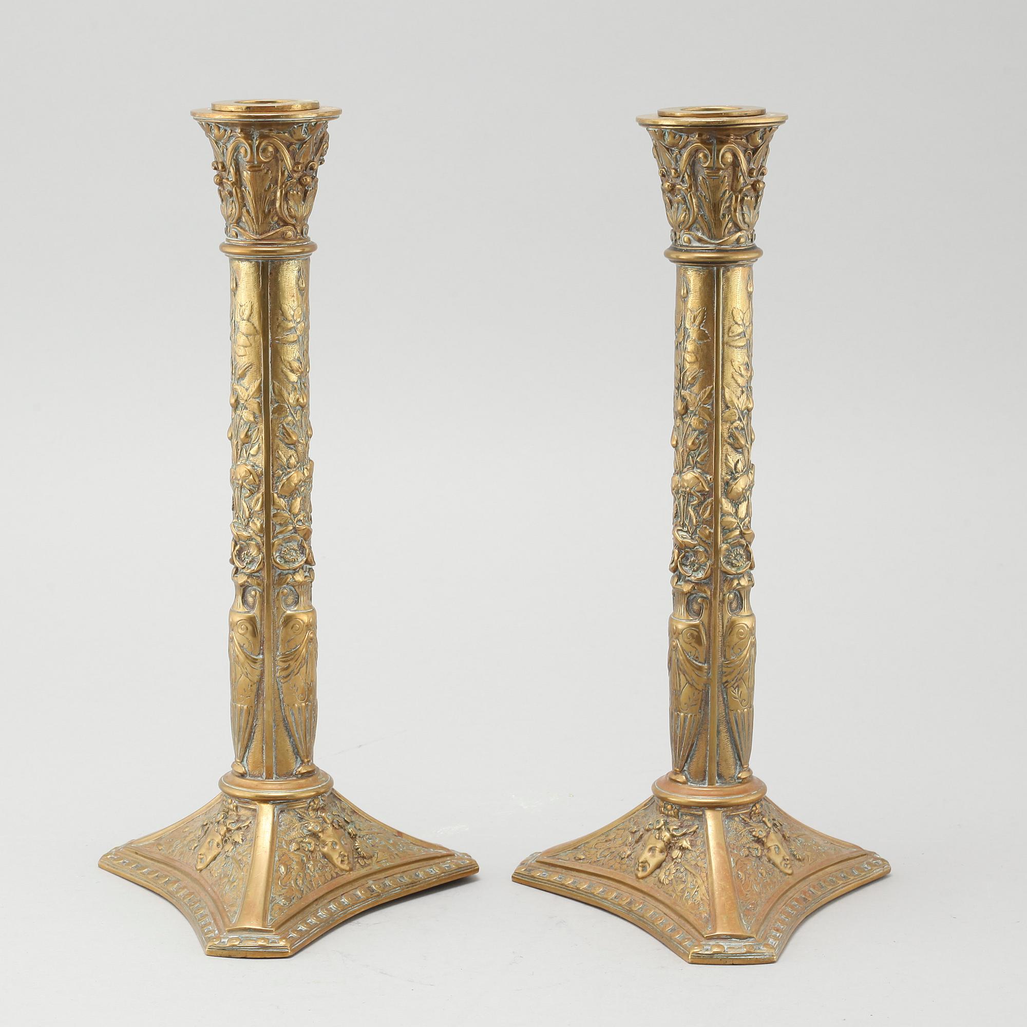 A pair of brass candlesticks from Elkingtons in Birmingham, 19th century.