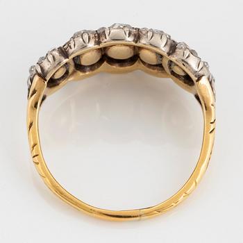 An 18K gold and silver ring set with rose-cut diamonds.