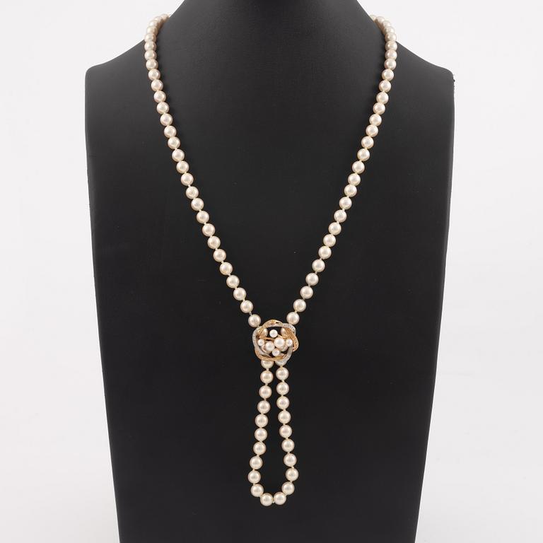 Necklace with imitation pearls, clasp 18K gold with amethyst, spacers 18K gold with pearls and diamonds.