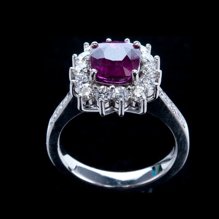 A RING, ruby c. 2.60 ct and diamonds c. 0.86 ct.