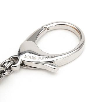 LOUIS VUITTON, a palladium finished brass and white bag charm, "Fleur d'epi".