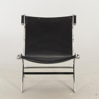 Paul Tuttle For Flexform Lounge Chair In Chrome And Black Leather.