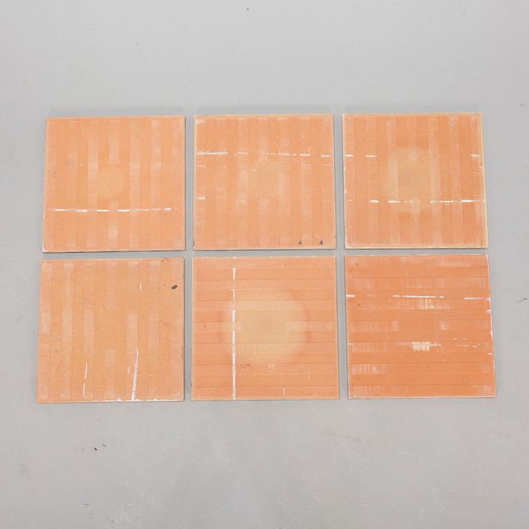 A set of six earthenware tile plates, after Salvador Dalí, late 20th century.