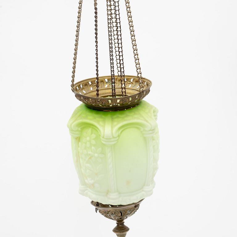 An art noveau glass and brass ceiling lamp from around the year 1900.