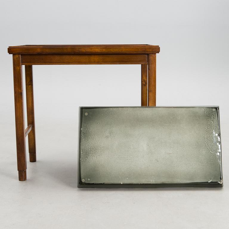 A stoneware tray table signed Bryk.