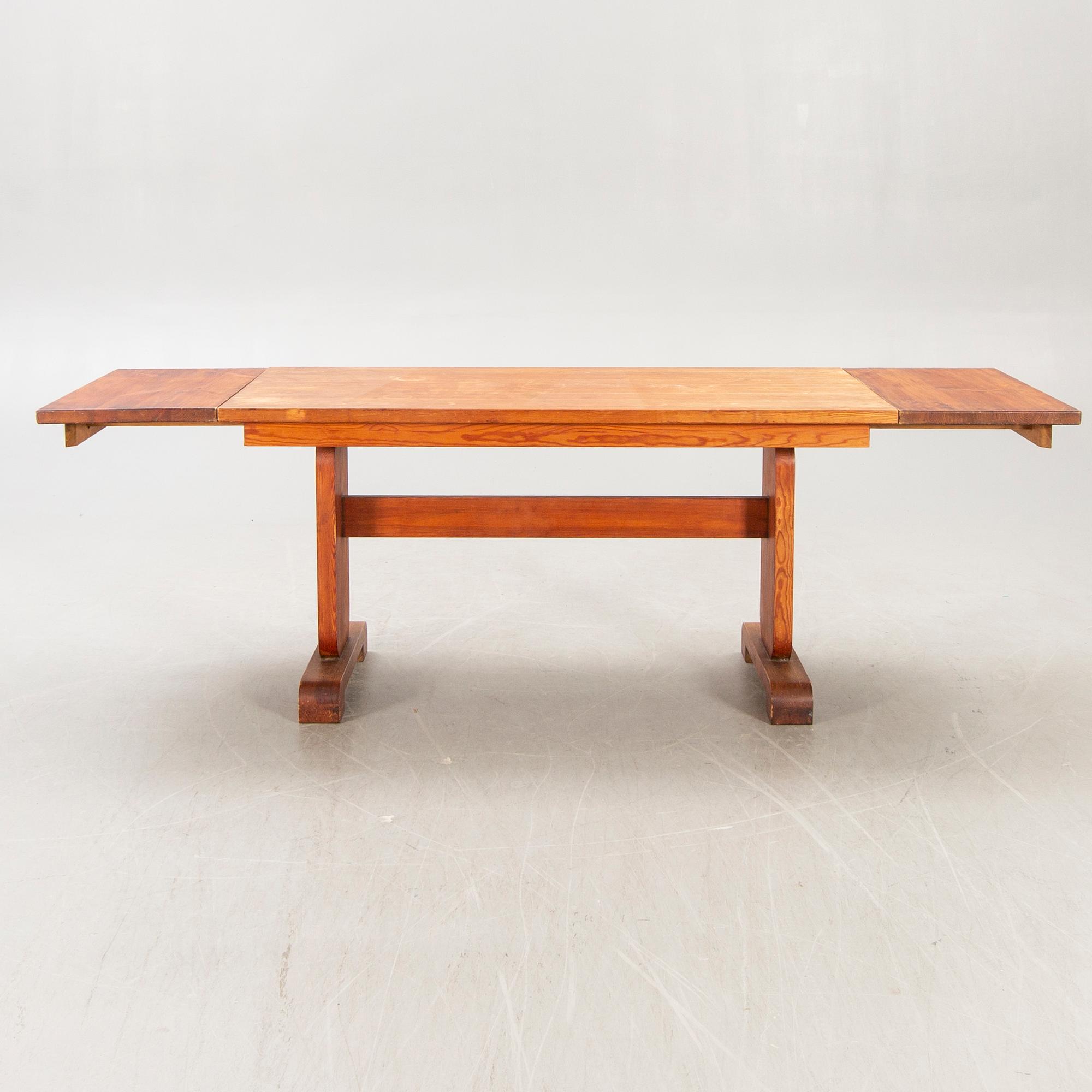 A 1940s pine dining table.