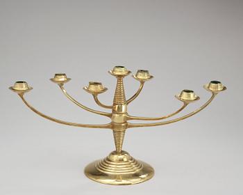 A brass candelabrum after Bruno Paul, Germany, early 20th C.