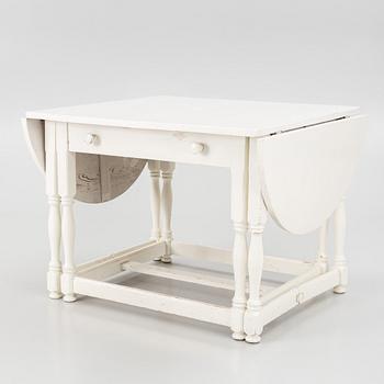 An early 20th century drop-leaf table.