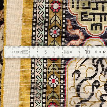 A rug, silk Quum, figural, ca 87 x 128 cm.