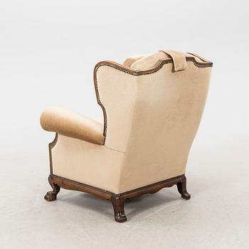 A fabric upholstered easy chair from the second half of the 20th Century.
