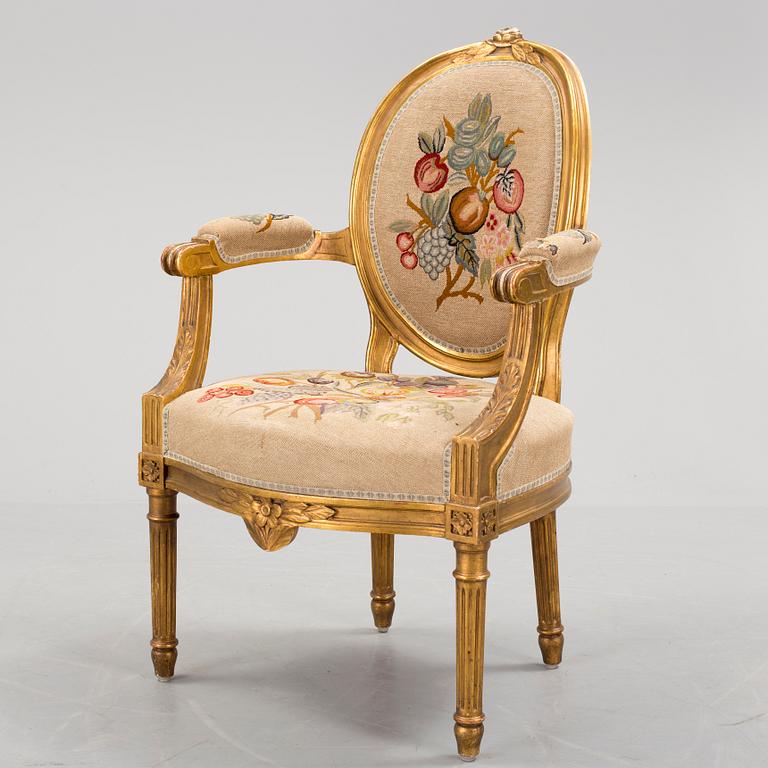 A Gustavian style arm chair, first half ot the 20th Century.