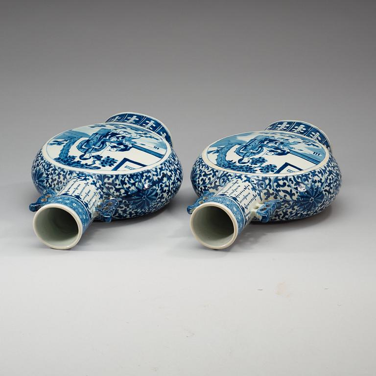 A pair of large blue and white moon flasks, late Qing dynasty (1644-1912), with Kangxi four character mark.