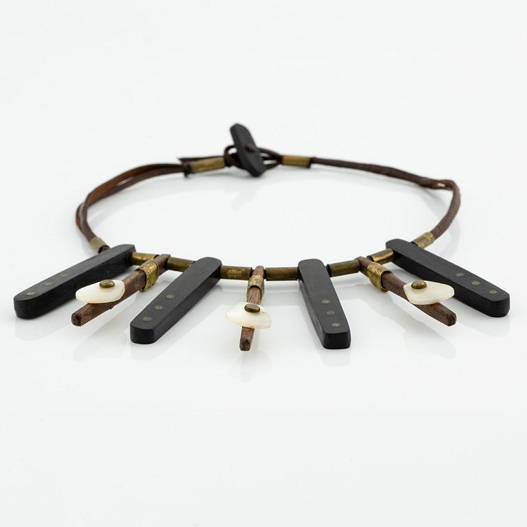 Vivianna Torun Bülow-Hübe, a necklace, wood, leather, mother-of-pearl and brass, most likely 1950's.