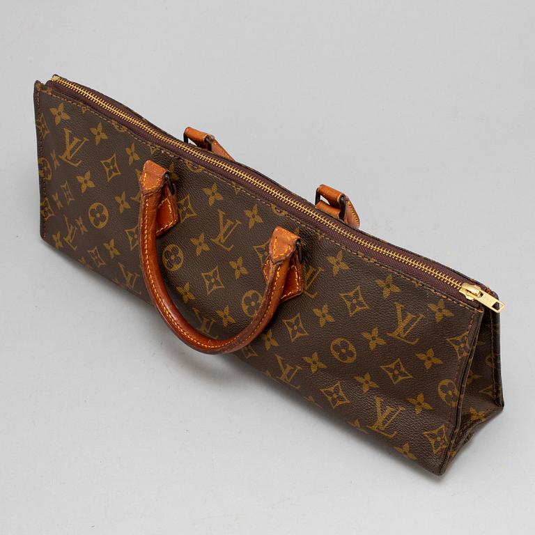 LOUIS VUITTON, a monogram canvas, 'Sac triangle' bag.