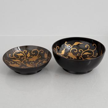 A set of six Japanese lacquer bowls with covers, 20th century.