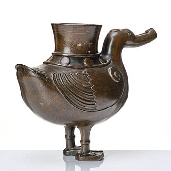 A bronze archaistic duck shaped vessel with silver inlay, Qing dynasty (1644-1912).