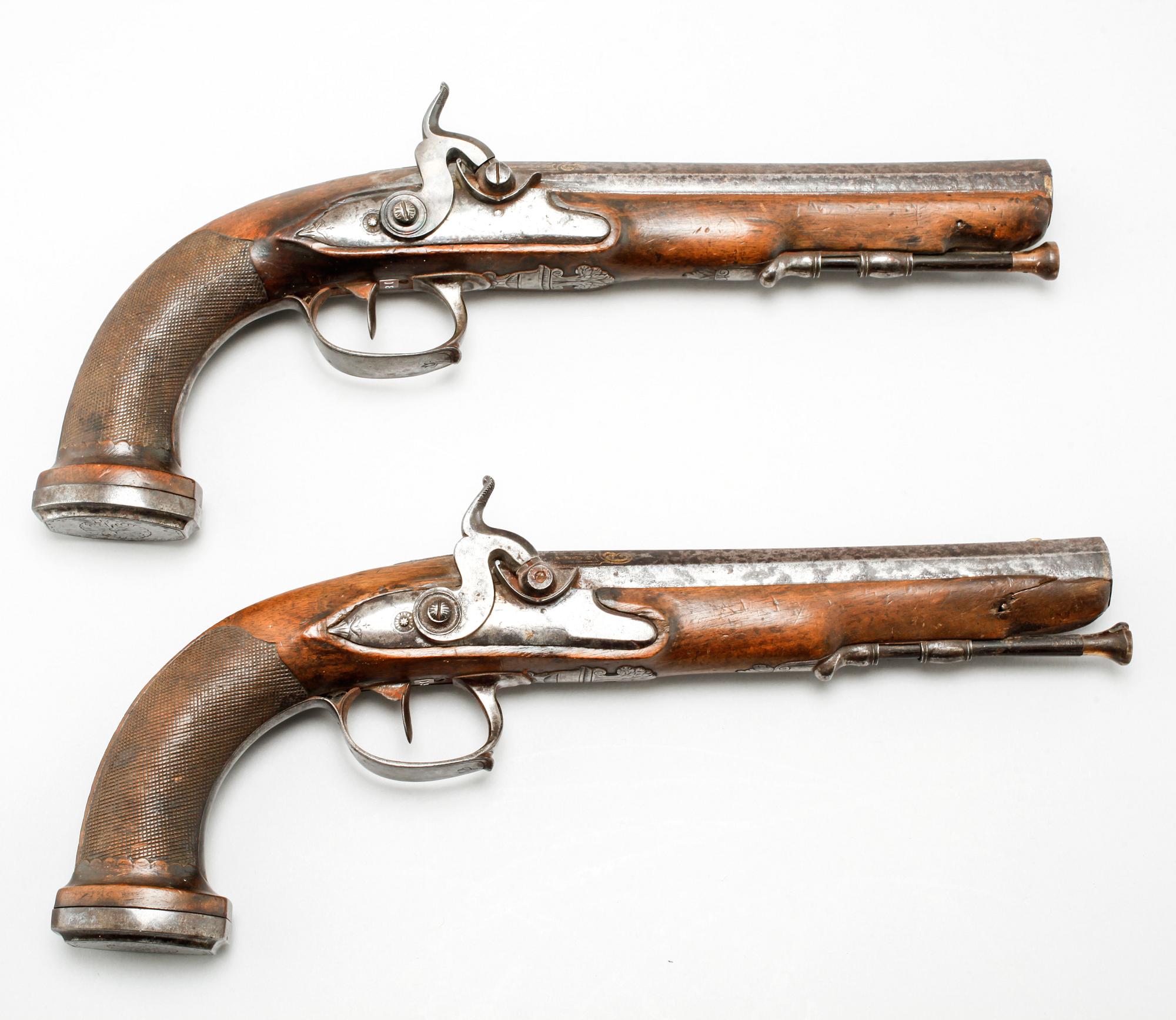 A pair of percussion guns, around the mid 19th century.