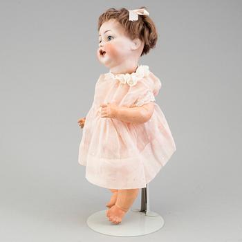 a porcelain doll from the early 20th century.