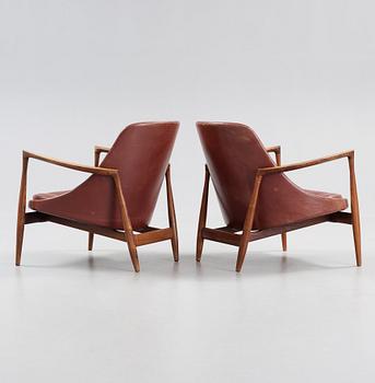 A pair of Ib Kofod Larsen palisander and brown leather 'Elisabeth' easy chairs, Denmark 1950's-60's.