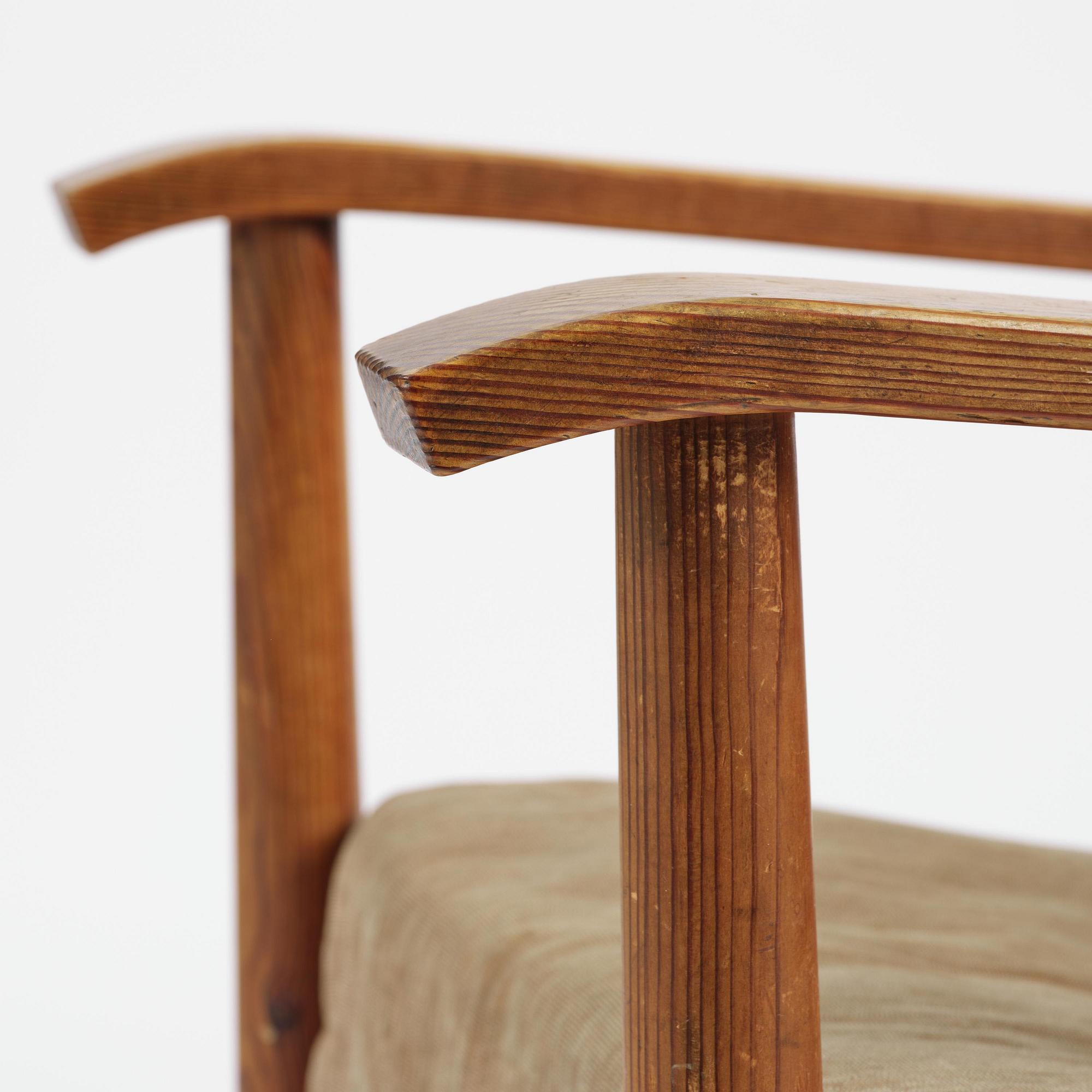 Axel Einar Hjorth, a pair of stained pine "Väddö" easy chairs, Nordiska Kompaniet, Sweden, 1930s-40s.