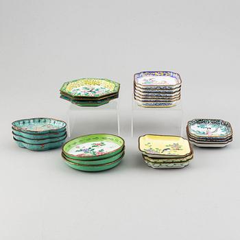 A set of 23 enamel on copper dishes, China, early 20th Century.