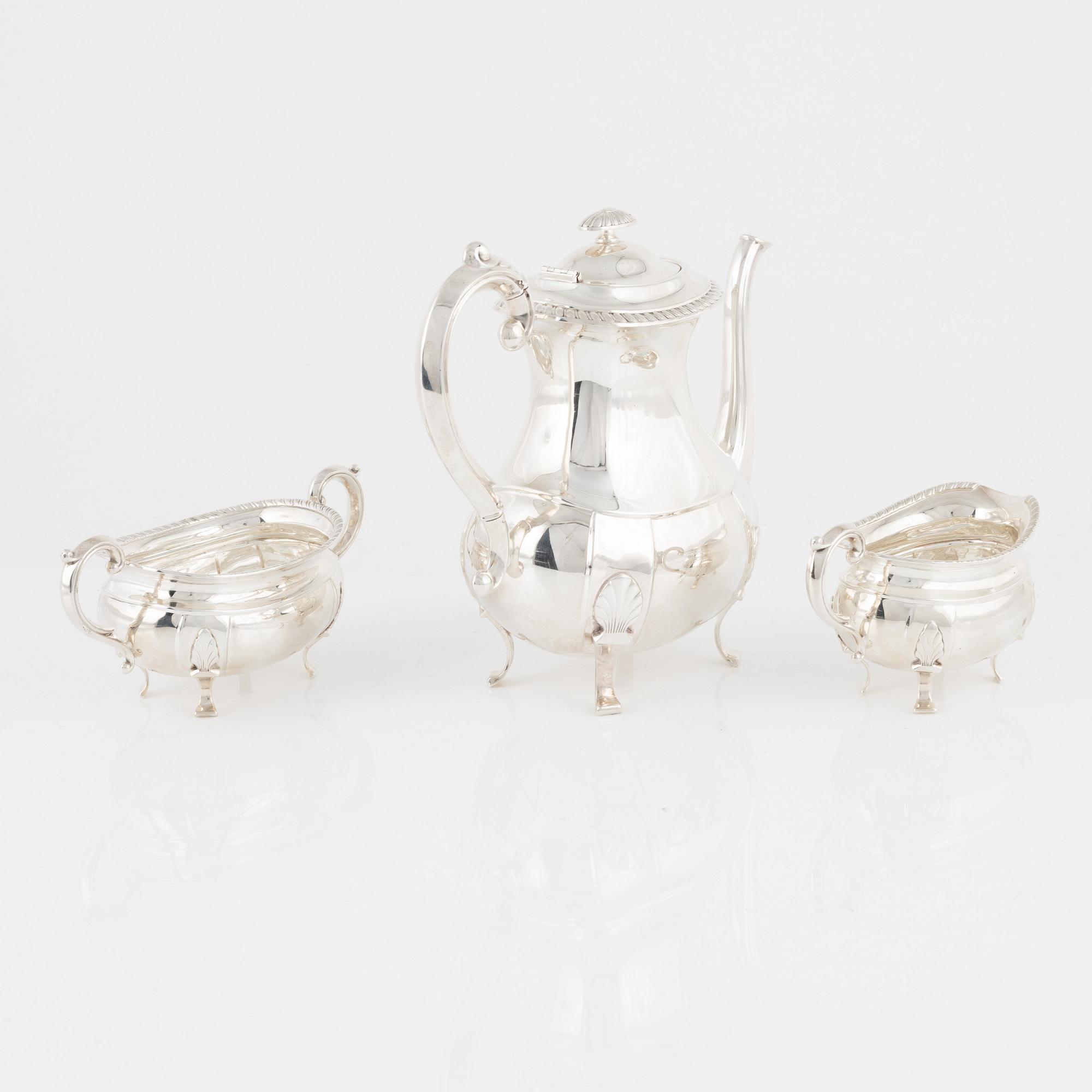 A Norwegian Silver Coffee Pot, Creamer and Sugar Bowl, mark of David Andersen, Oslo, mid-20th Century.