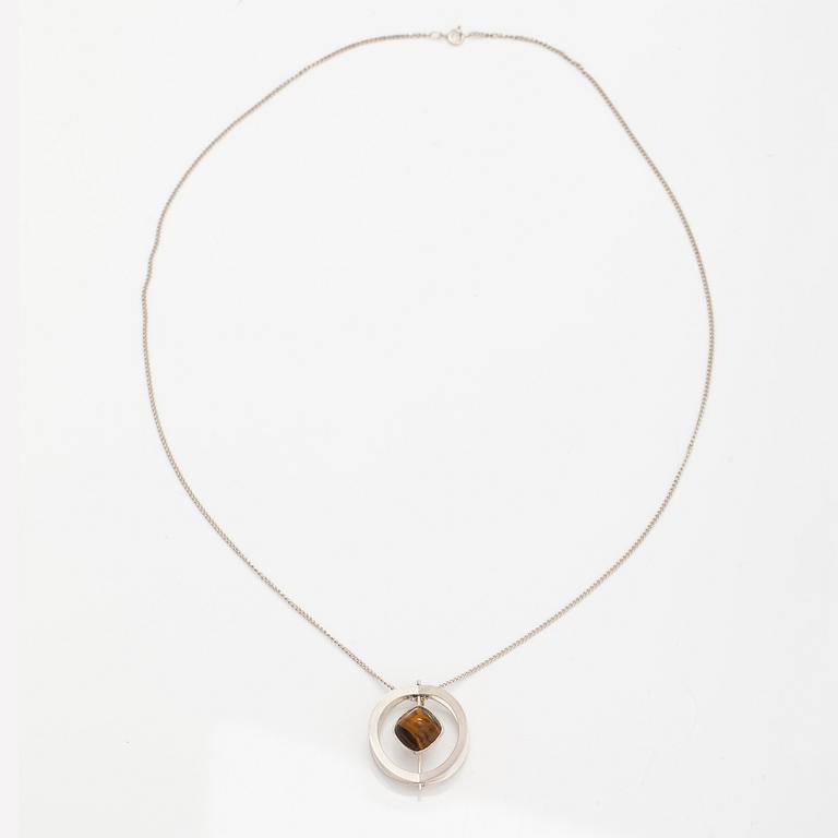 Elis Kauppi, A silver necklace/brooch with a tiger's eye. Kupittaan kulta, turku 1961.