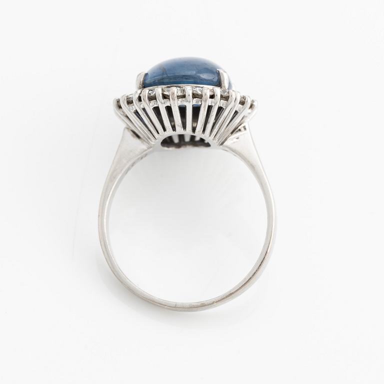 Ring with cabochon-cut sapphire and brilliant-cut diamonds.