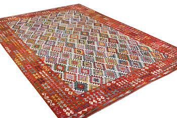 A Kilim carpet, c. 443 x 313 cm.