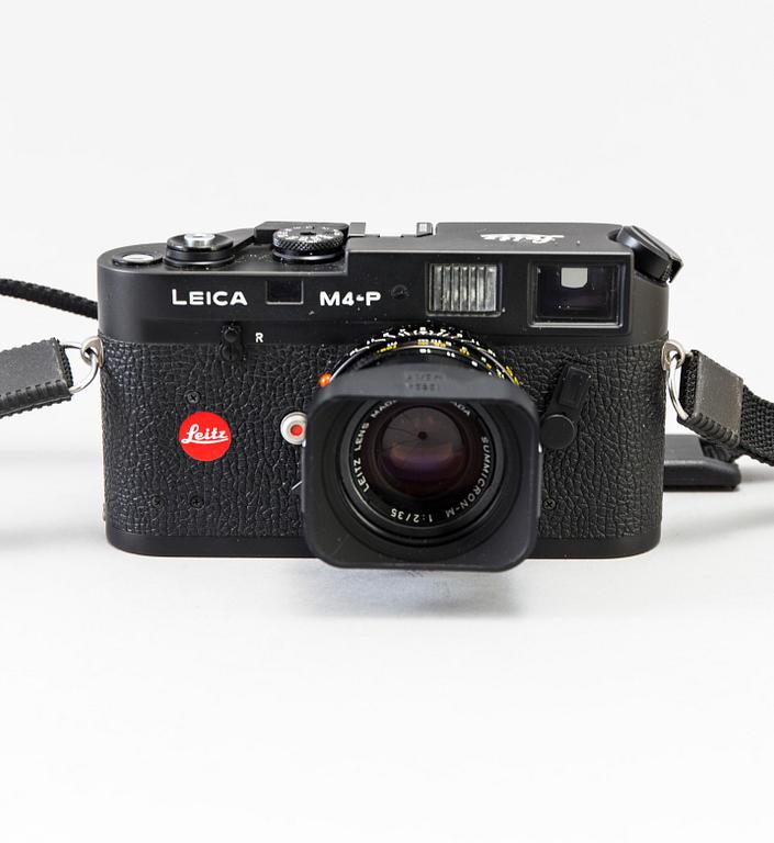 a black body Leica M4-P camera with no 1605951 made by Leitz Canada in 1982. With two lenses and a Leica Meter.