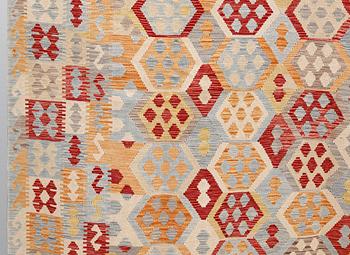 A kilim carpet, ca 340 x 259 cm.